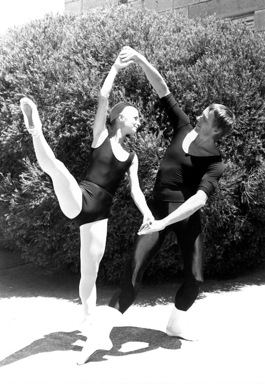Ballerina dancing with teacher