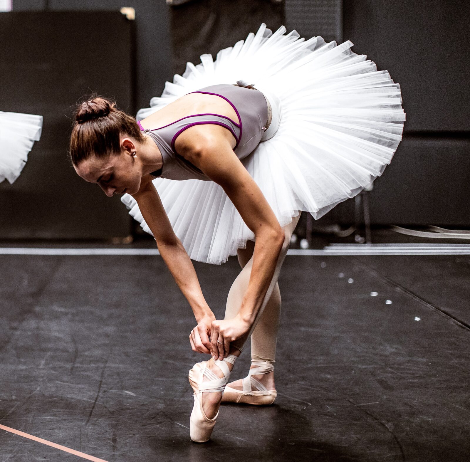 Dancer tightening shoe
